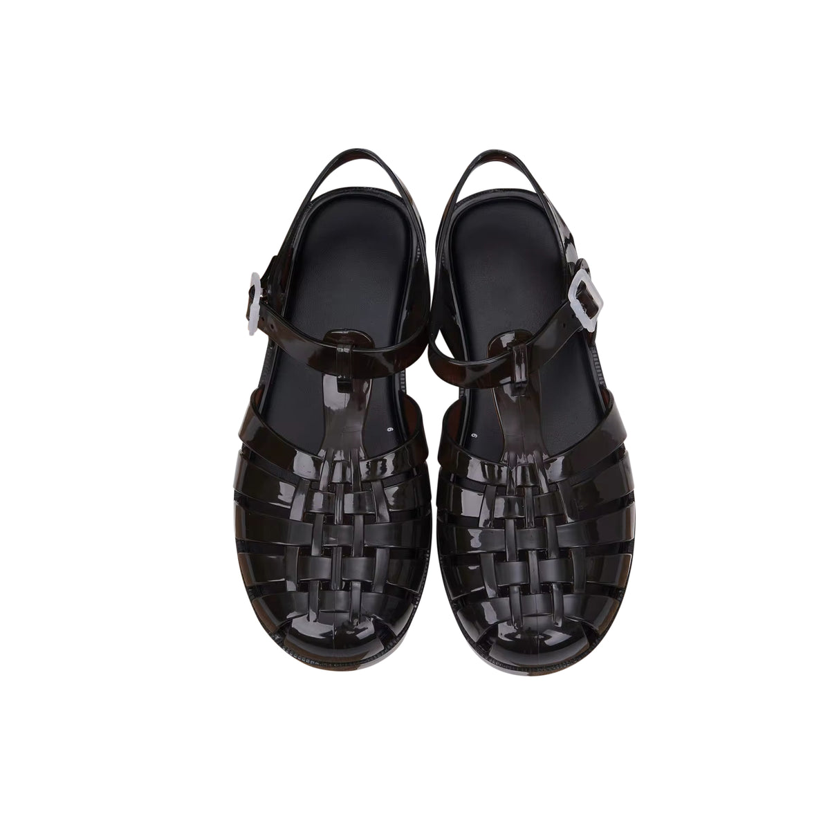 The Black Bubble Jelly Shoe has an adjustable single strap with a grip sole, named for its soft cushioning. The waterproof sandal is pared back and versatile — a perfect addition to the summer wardrobe.